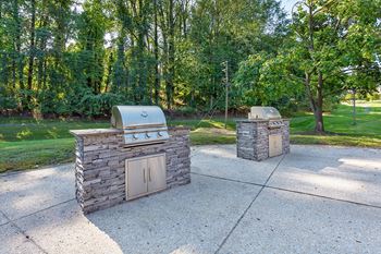 Two barbecue pits in a park